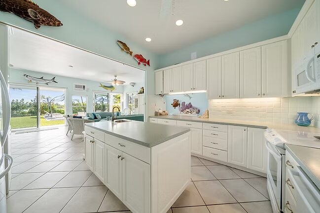 Island kitchen open to living room and ocean