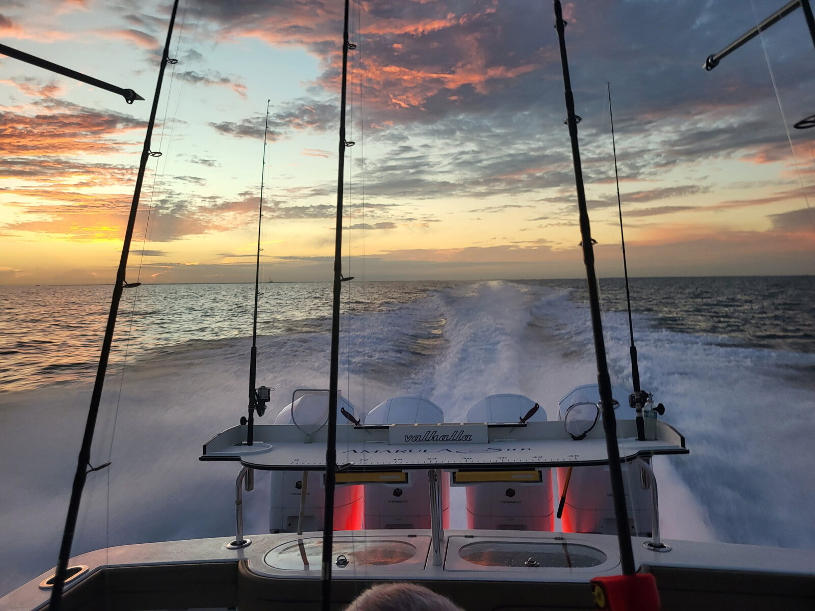 Sunset wake offshore